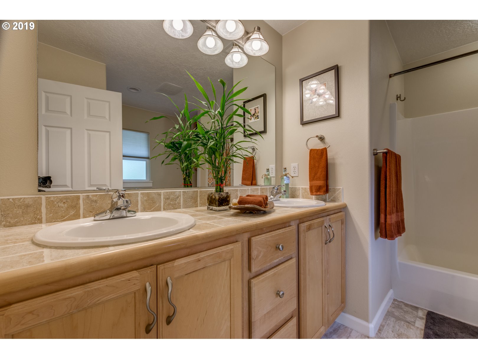 5859 Southwest Oleson Road Portland, OR 97225 - Photo 13 of 32 a bathroom with a sink and a mirror