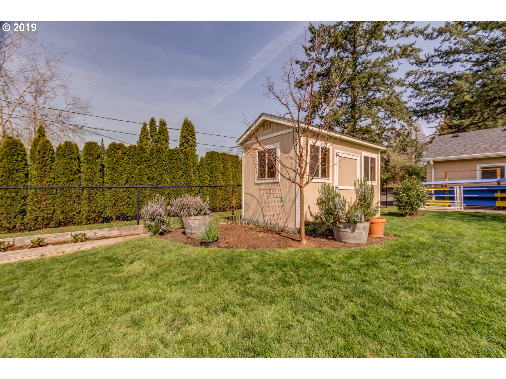 5859 Southwest Oleson Road Portland, OR 97225 - Photo 31 of 32 a view of a house with a big yard and large trees