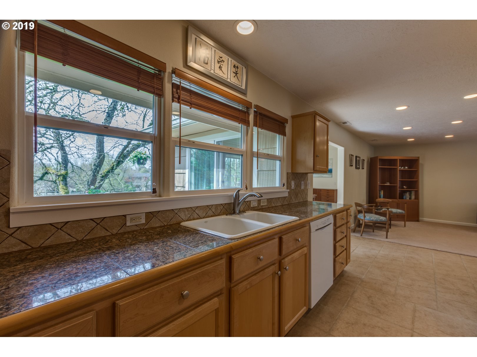 5859 Southwest Oleson Road Portland, OR 97225 - Photo 8 of 32 a kitchen with a sink and large window