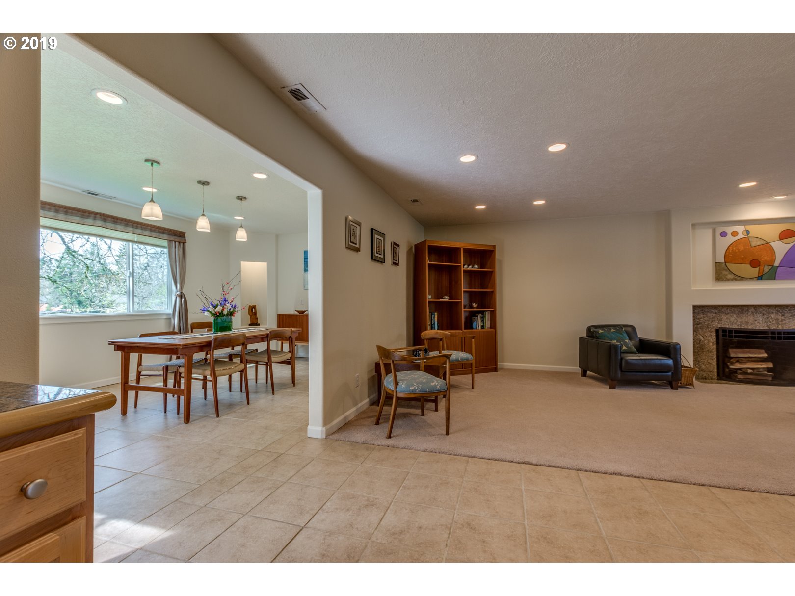 5859 Southwest Oleson Road Portland, OR 97225 - Photo 9 of 32 a living room with furniture and a fireplace