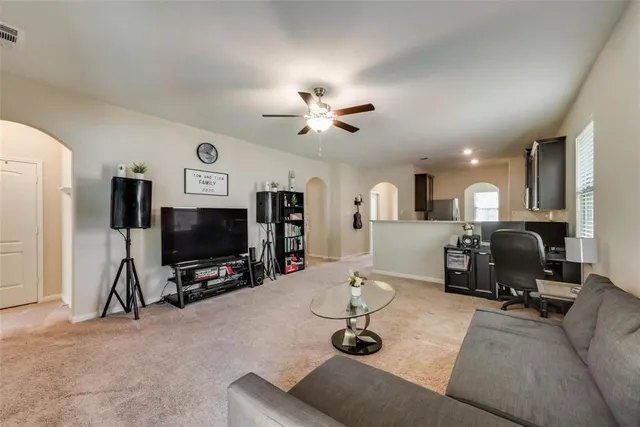 a living room with furniture and a window