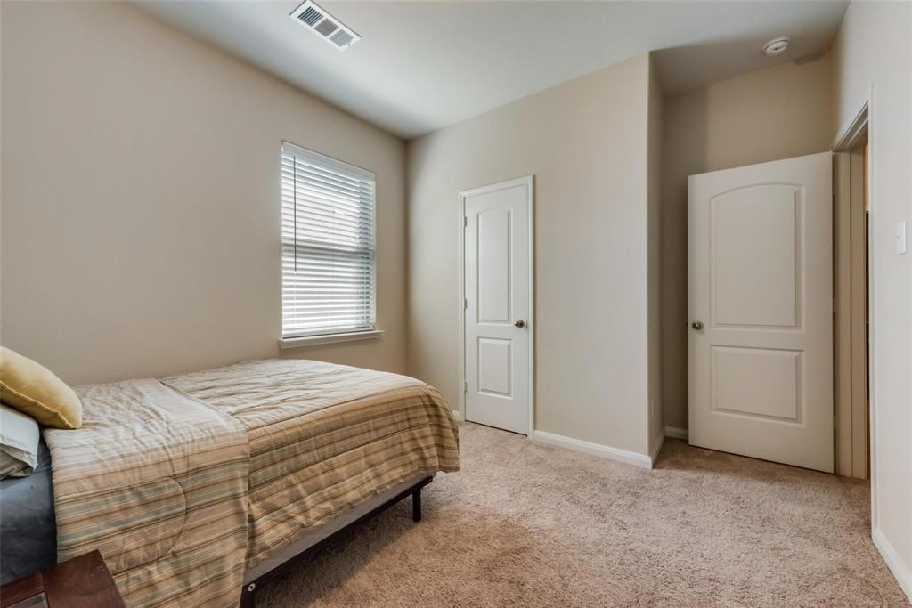 2213 Georgetown Street Princeton, TX 75407 - Photo 16 of 25 Bedroom with light carpet and baseboards