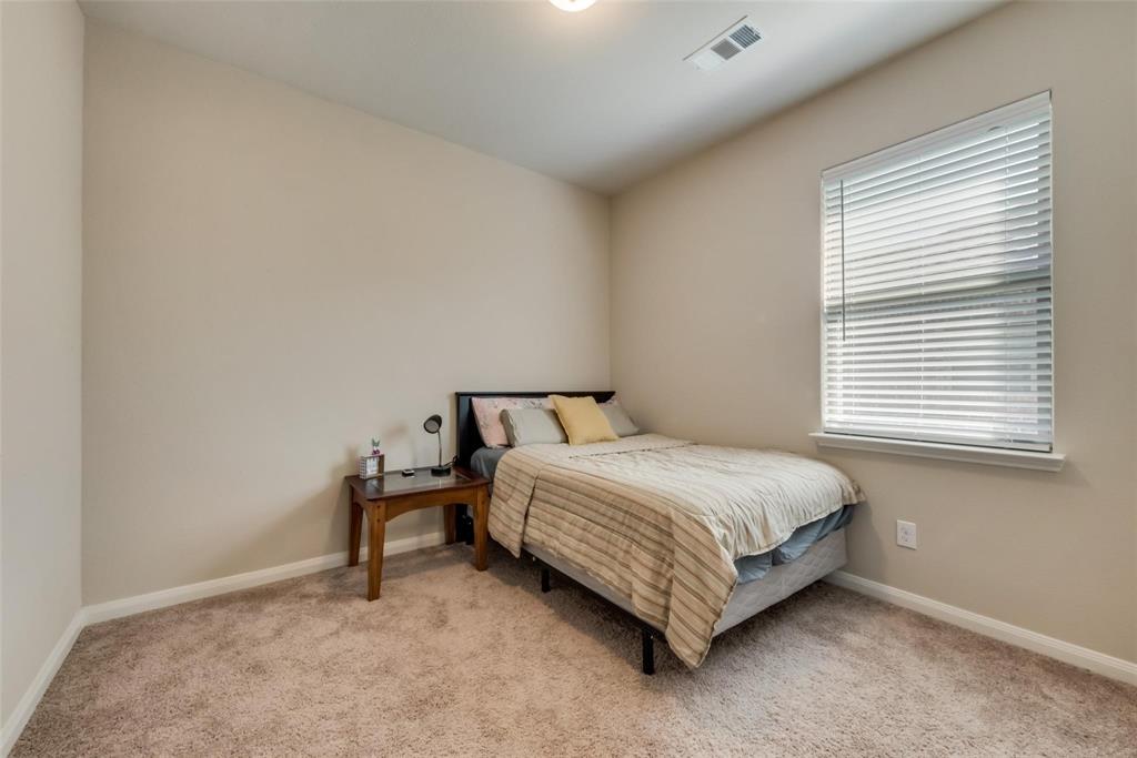 2213 Georgetown Street Princeton, TX 75407 - Photo 17 of 25 Bedroom with light colored carpet and baseboards