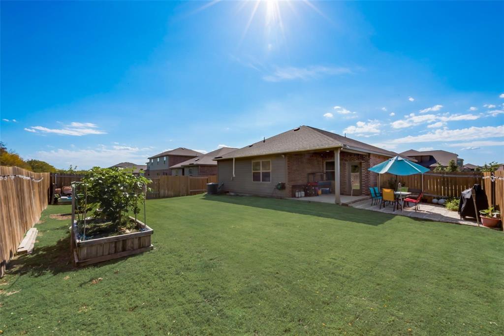 2213 Georgetown Street Princeton, TX 75407 - Photo 4 of 25 Rear view of property with a fenced backyard, a patio, and brick siding