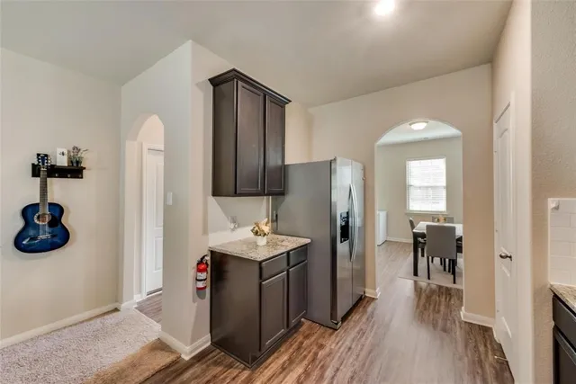 a view of a kitchen cabinets and wooden floor