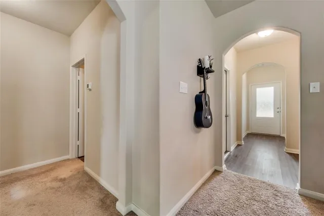 a view of a room with wooden floor lounge chair and windows