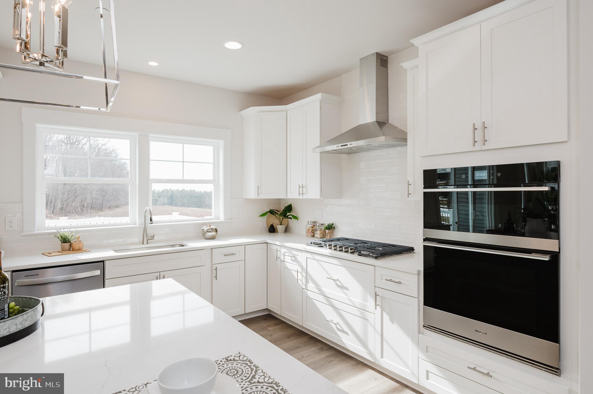 1605 A Oakland Road Freeland, MD 21053 - Photo 10 of 32 a kitchen with stainless steel appliances granite countertop a stove a sink and a microwave