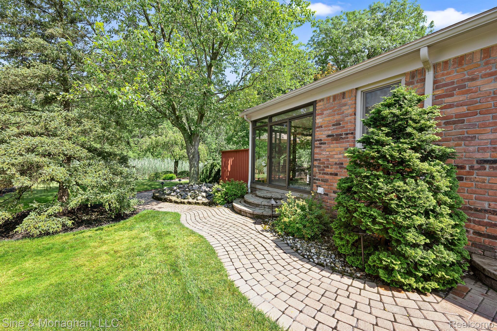 35104 Banbury Road Livonia, MI 48152 - Photo 43 of 62 Paver walkway along side of house