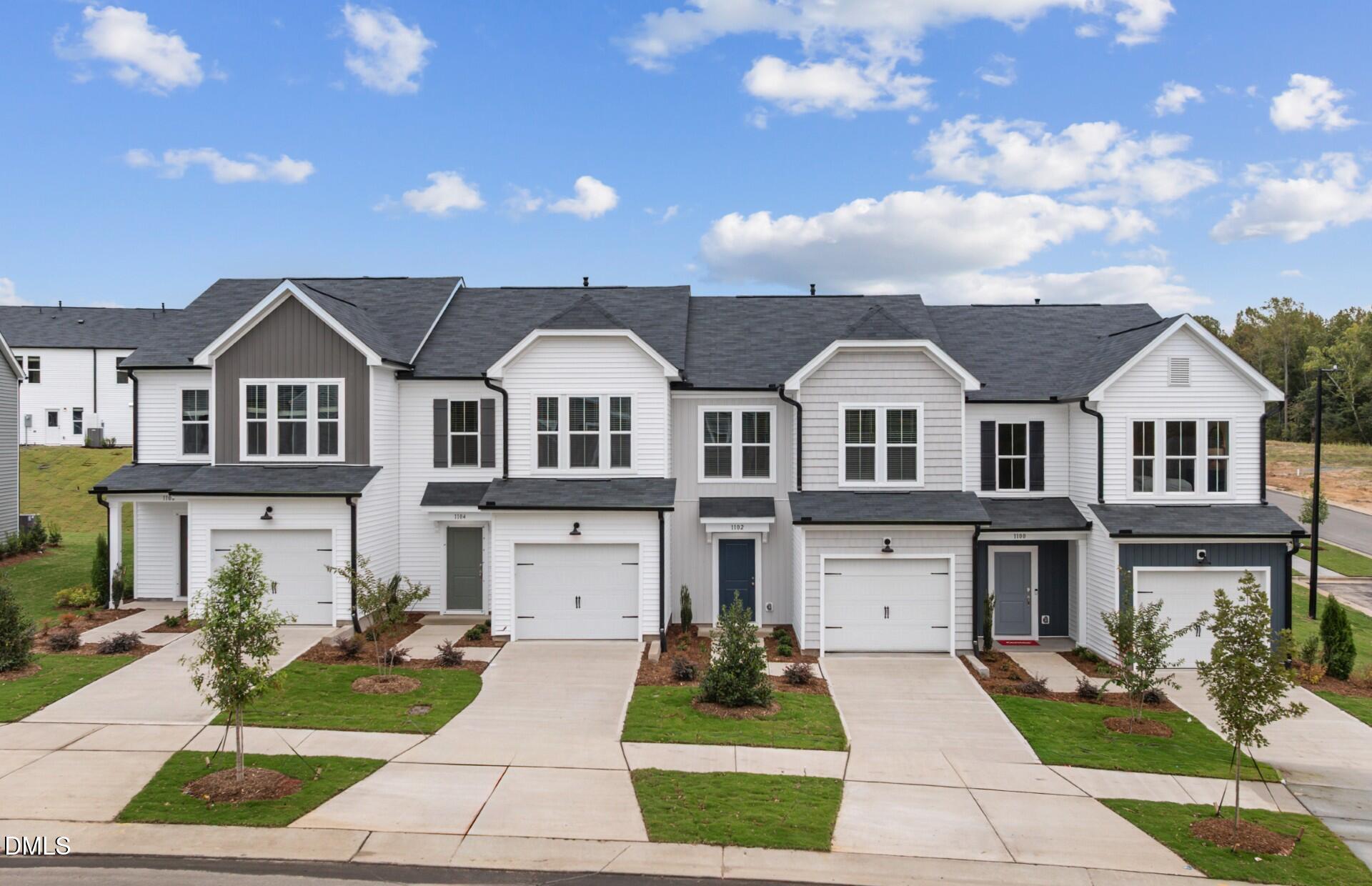 3034 Hammer Creek Road Durham, NC 27704 - Photo 17 of 19 a front view of a house with garden