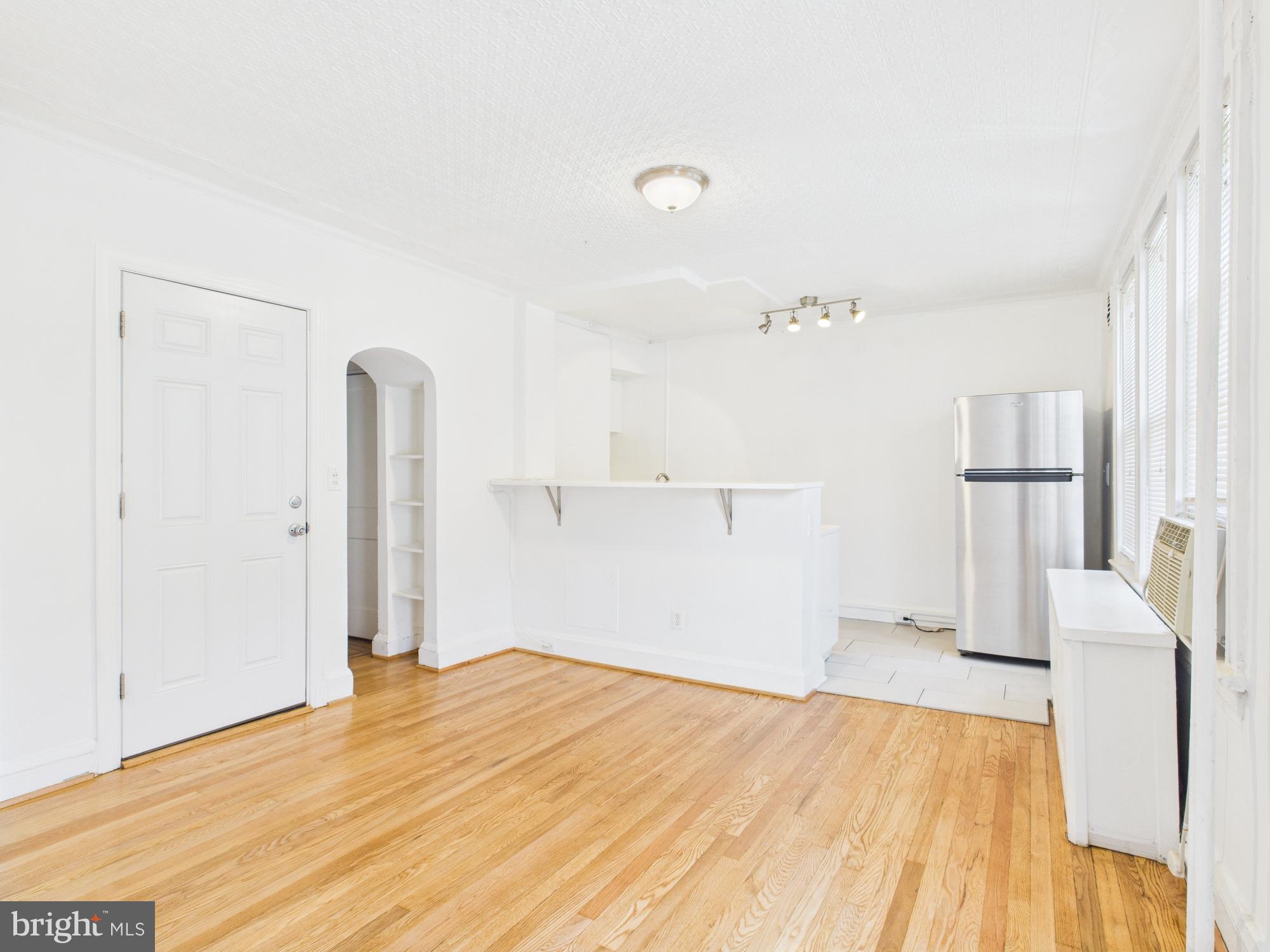 205 East 33rd Street, Unit 3 Baltimore, MD 21218 - Photo 16 of 18 a view of empty room with wooden floor