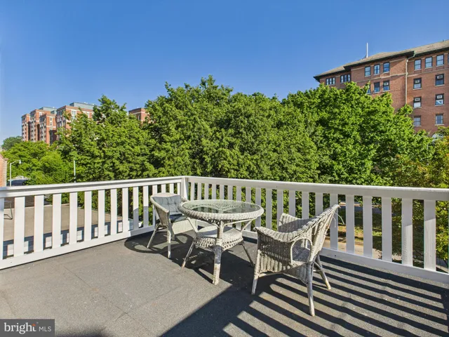 a view of a balcony with chairs