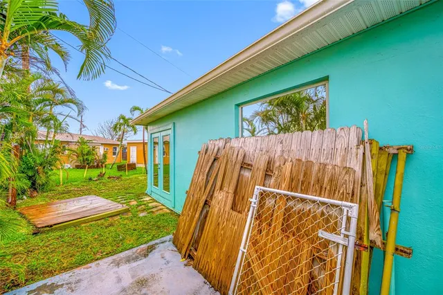 a view of a bathroom with a tub shower and mirror