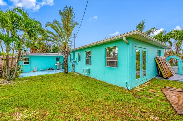 a view of an entryway with wooden floor and windows