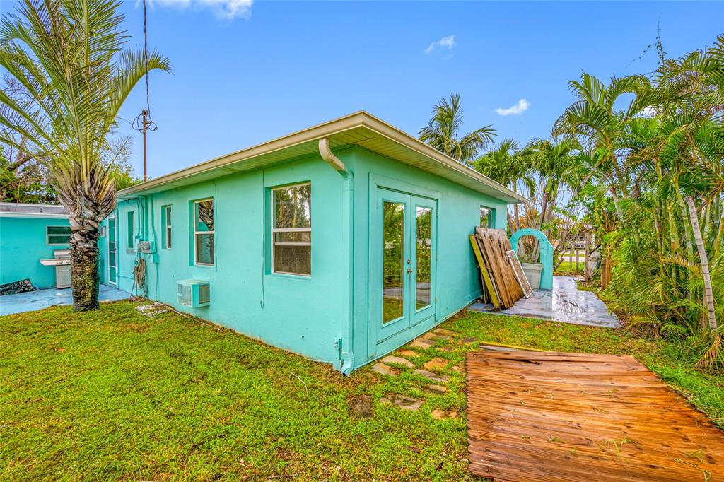 14111 West Parsley Drive Madeira Beach, FL 33708 - Photo 14 of 99 a view of a house with a yard