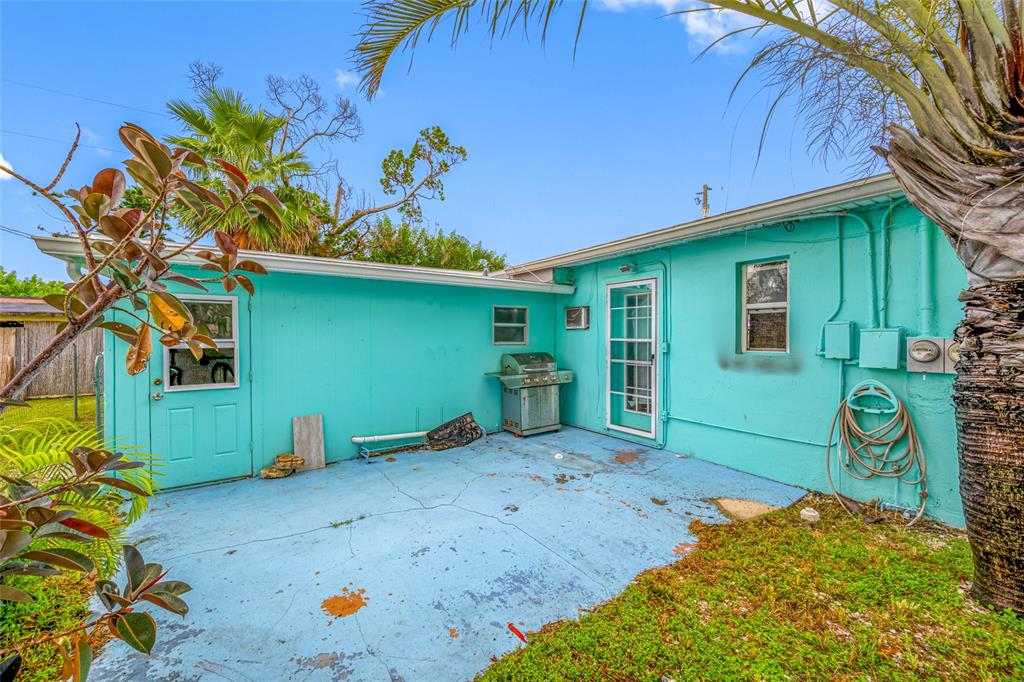 14111 West Parsley Drive Madeira Beach, FL 33708 - Photo 15 of 99 a front view of a house with garden