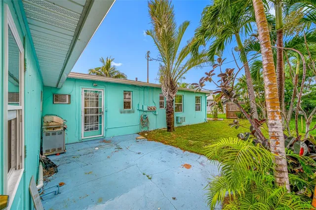 a view of an empty room with windows
