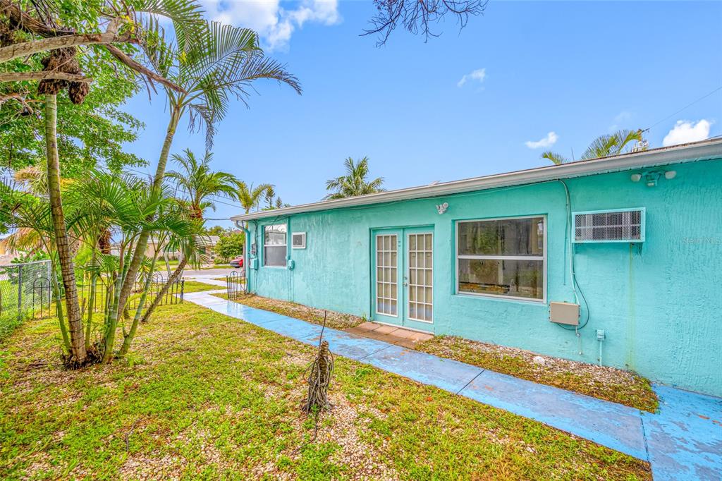 14111 West Parsley Drive Madeira Beach, FL 33708 - Photo 21 of 99 a house with swimming pool in front of it