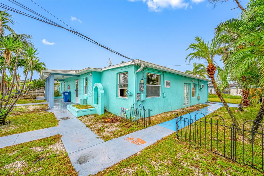 14111 West Parsley Drive Madeira Beach, FL 33708 - Photo 22 of 99 a view of a house with a swimming pool
