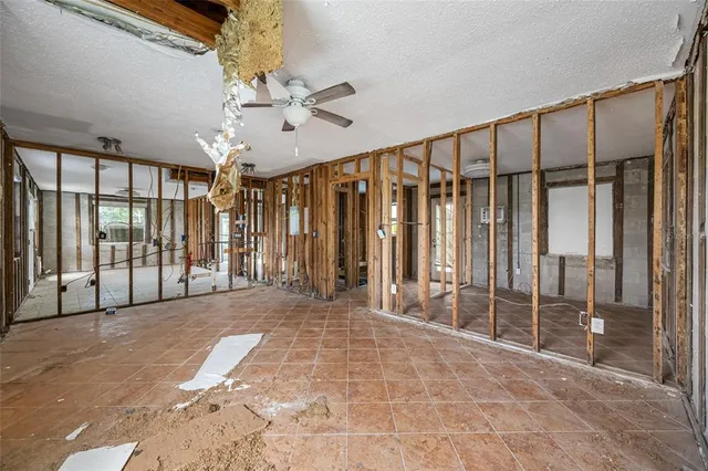 a view of a dining room with furniture a couch and wooden floor
