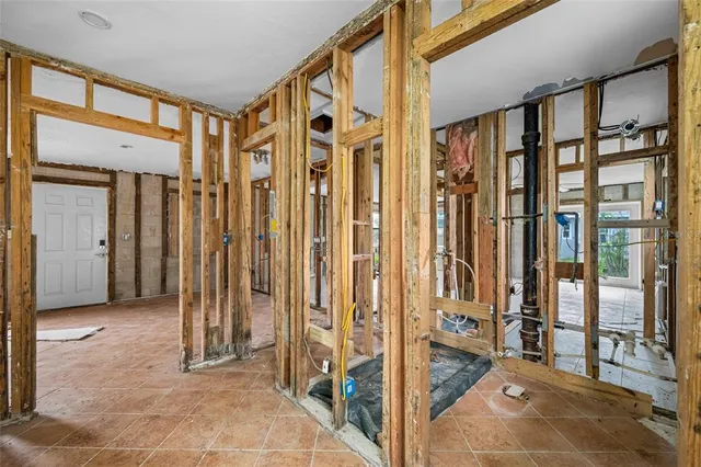 a bedroom with furniture and a closet