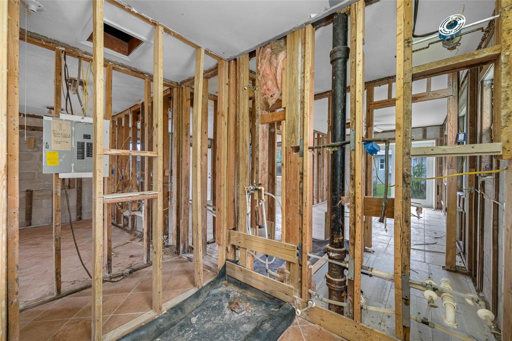 14111 West Parsley Drive Madeira Beach, FL 33708 - Photo 34 of 99 a view of an entryway with wooden floor and windows