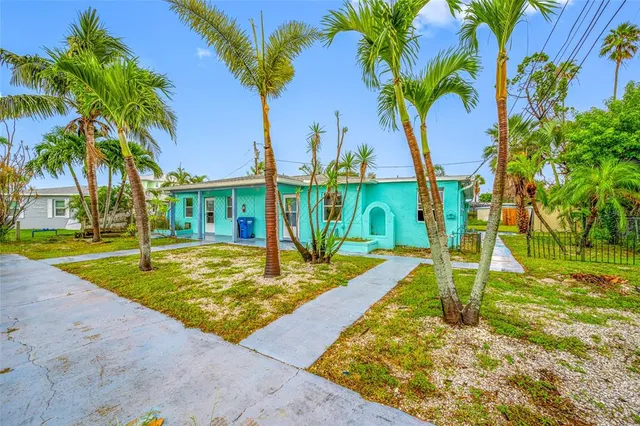 a house with a tree in front of it