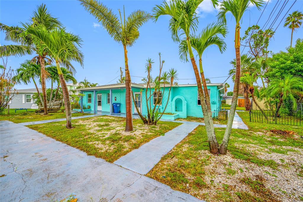 14111 West Parsley Drive Madeira Beach, FL 33708 - Photo 8 of 99 a view of a backyard with swimming pool