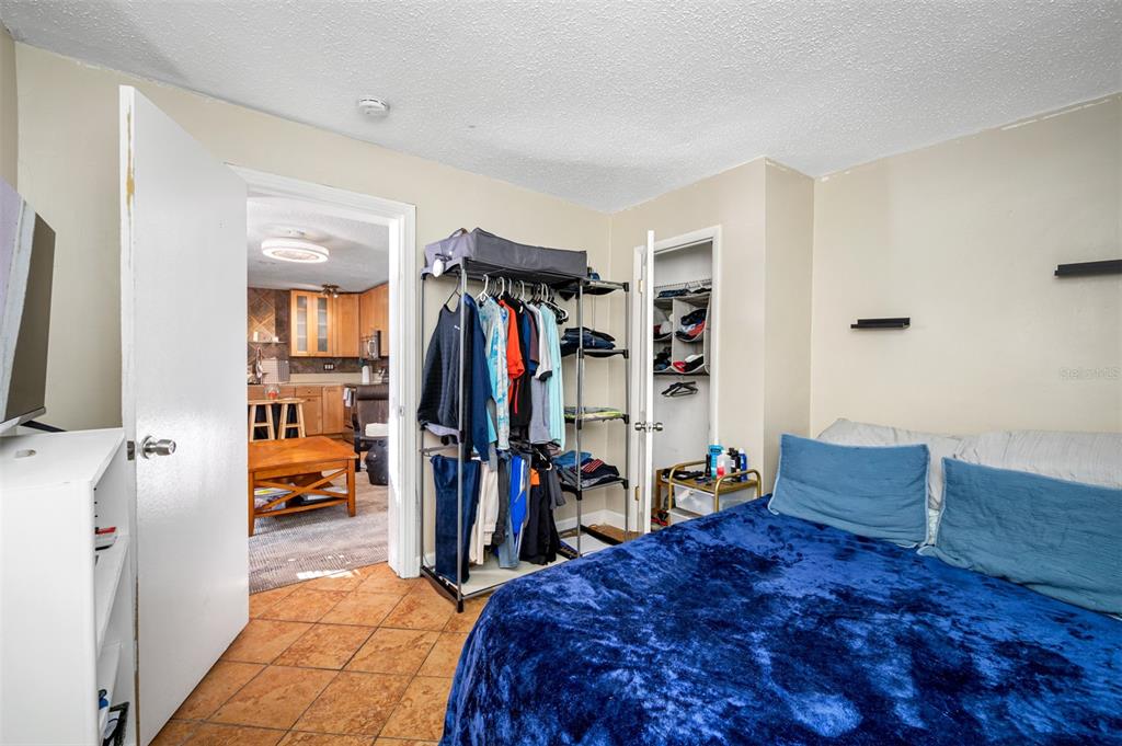 14111 West Parsley Drive Madeira Beach, FL 33708 - Photo 87 of 99 a bed room with a bed and a walk in closet