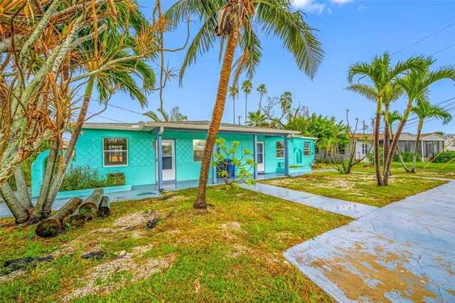 a house with swimming pool in front of it
