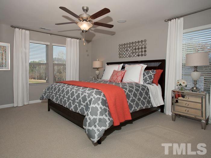 3013 Bluegrove Road, Unit 150 Raleigh, NC 27610 - Photo 22 of 25 a bedroom with a bed and a large window