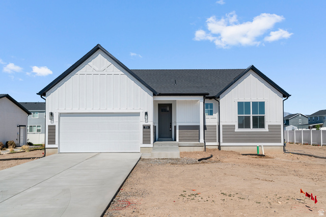 3016 West 2650 North Clinton, UT 84015 - Photo 1 of 20 Modern farmhouse featuring an attached garage, concrete driveway, a porch, board and batten siding, and a shingled roof