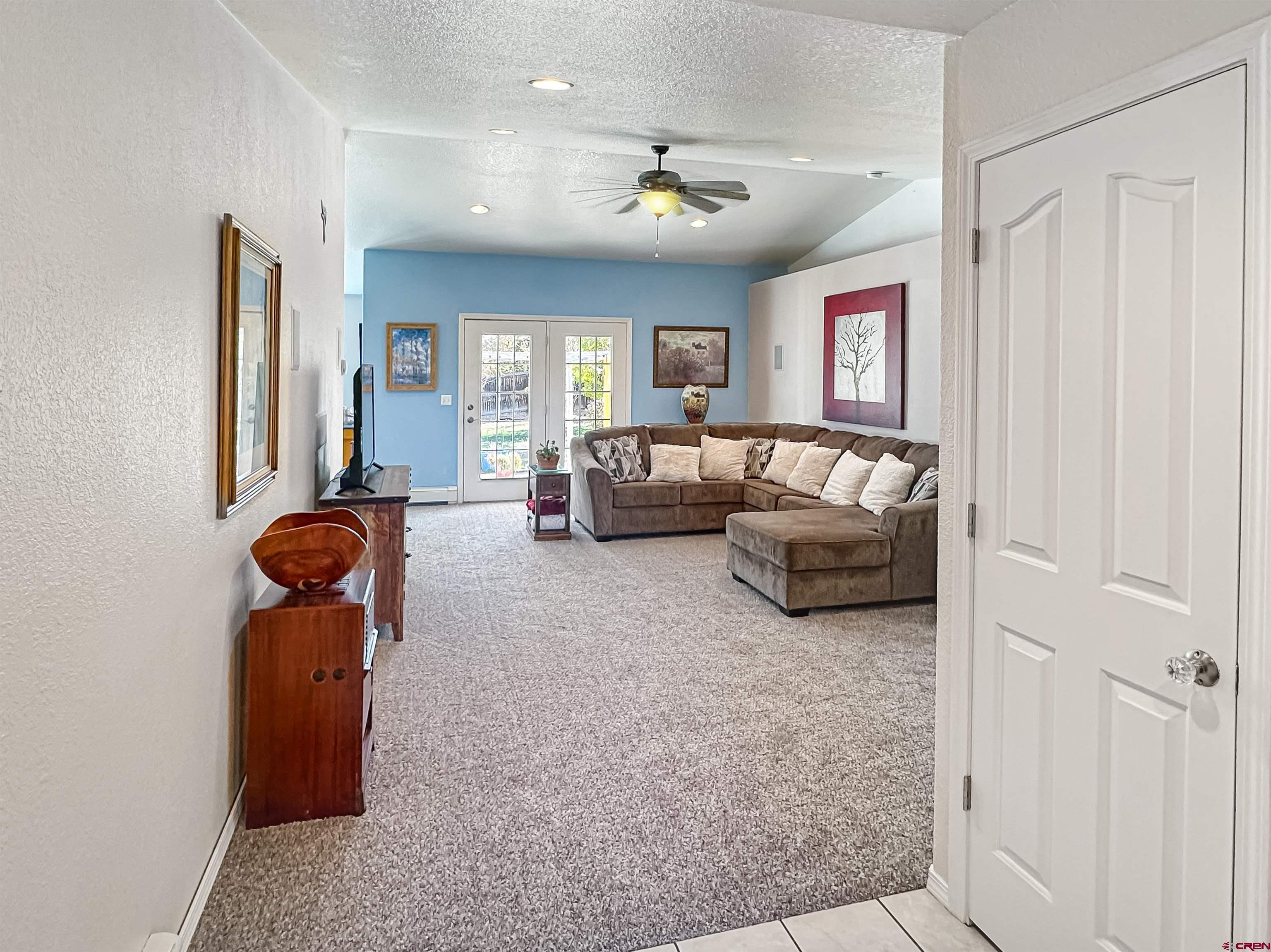 1810 Rolling Road Cortez, CO 81321 - Photo 3 of 18 a living room with furniture and a large window