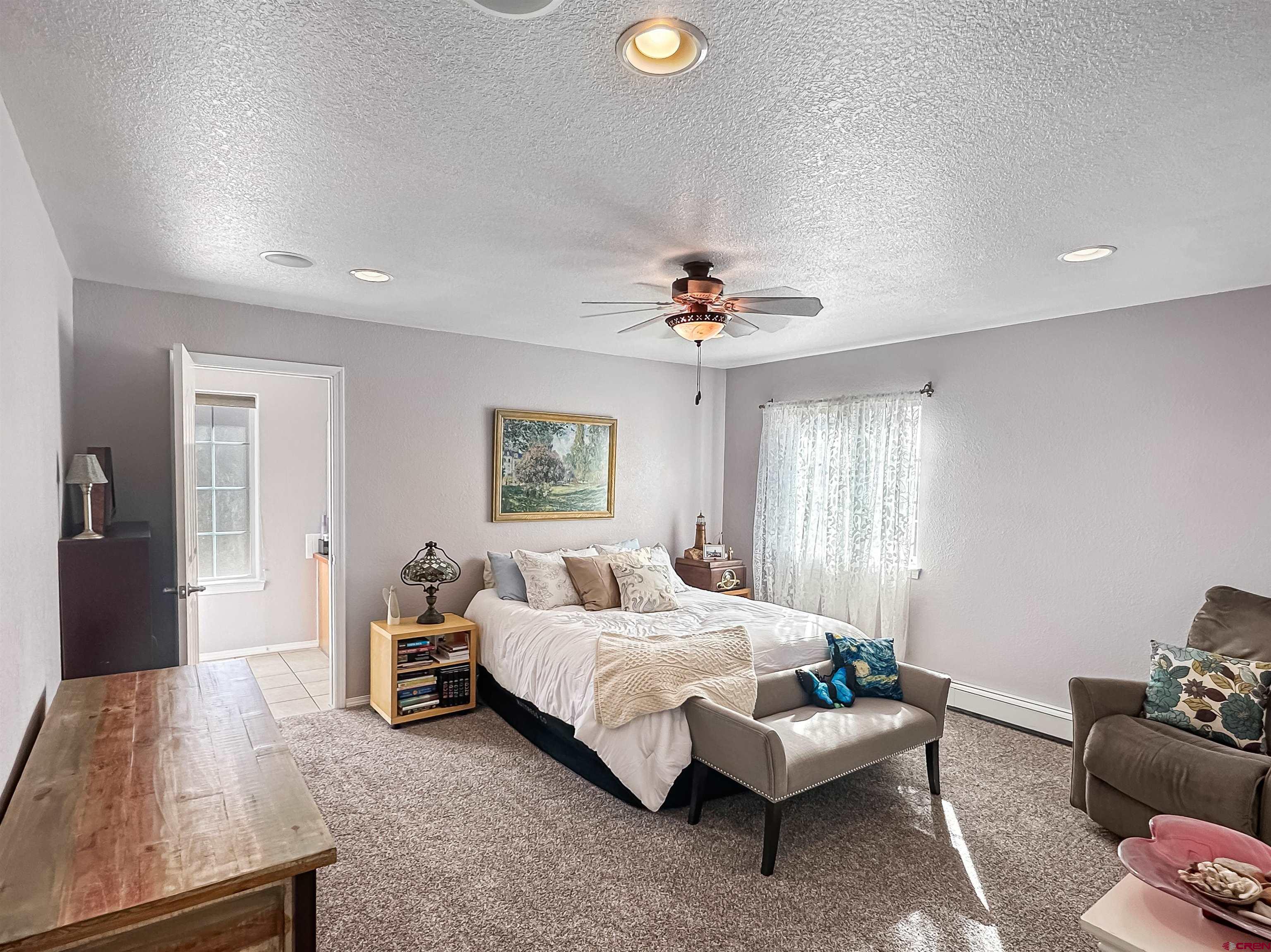 1810 Rolling Road Cortez, CO 81321 - Photo 5 of 18 a bedroom with a bed and furniture