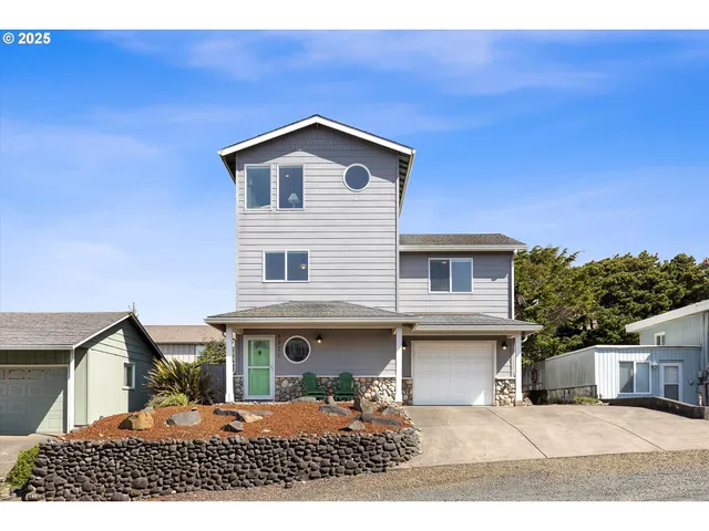a view of a house with wooden fence
