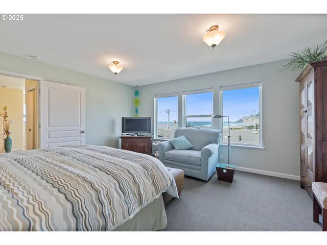 a bedroom with bed and window