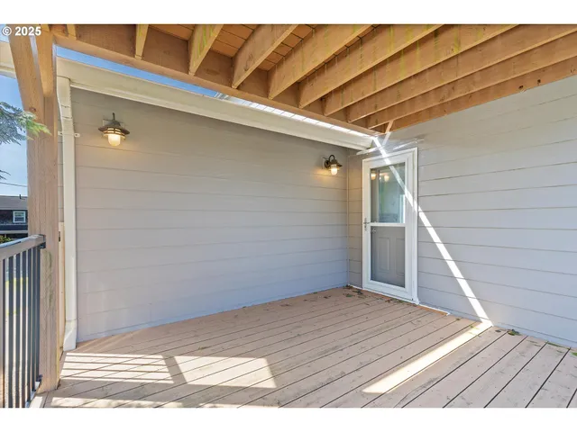 a bedroom with two beds and a window