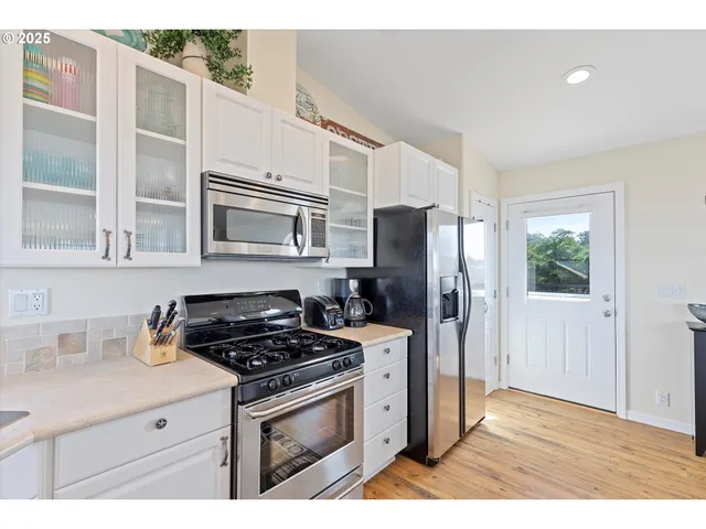 a view of balcony with wooden floor and fence