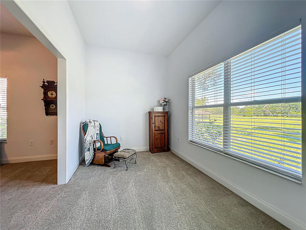 10222 Rockridge Road Lakeland, FL 33810 - Photo 19 of 39 a view of a room with gym equipment and windows
