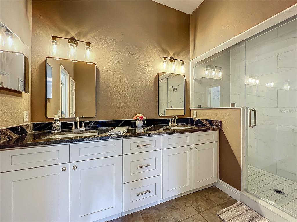 10222 Rockridge Road Lakeland, FL 33810 - Photo 21 of 39 a bathroom with double sink and a mirror
