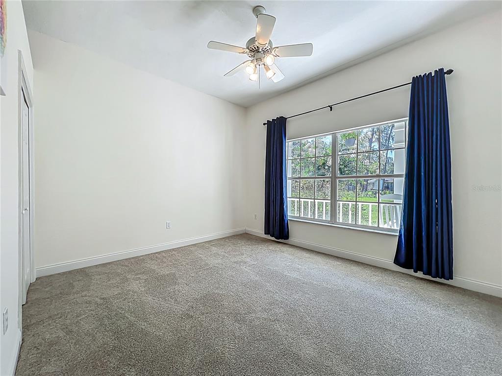 10222 Rockridge Road Lakeland, FL 33810 - Photo 23 of 39 a view of a livingroom with a ceiling fan and window