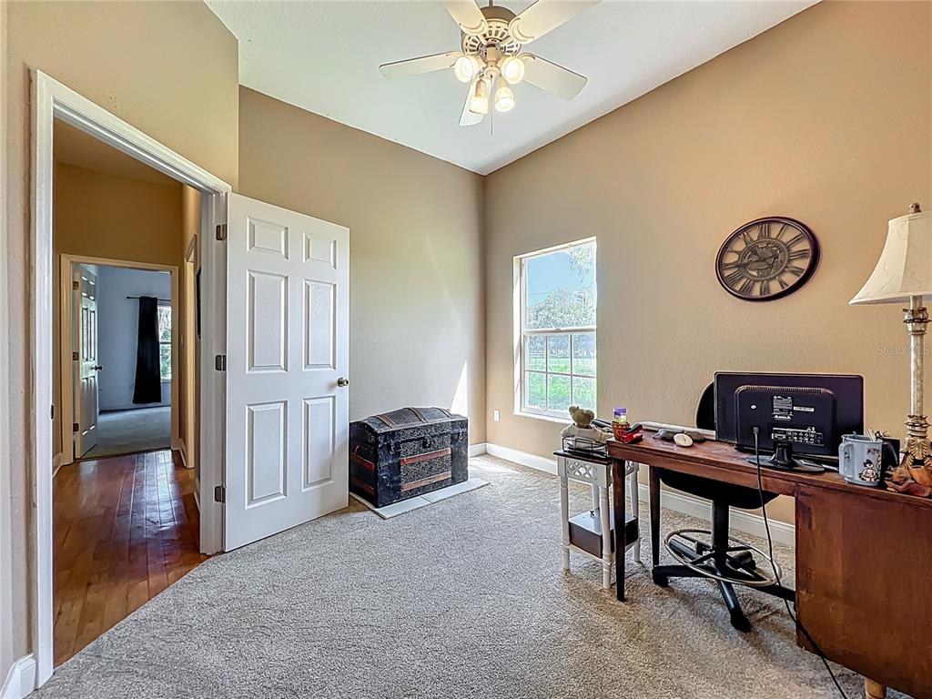 10222 Rockridge Road Lakeland, FL 33810 - Photo 24 of 39 a view of a livingroom with workspace and a window