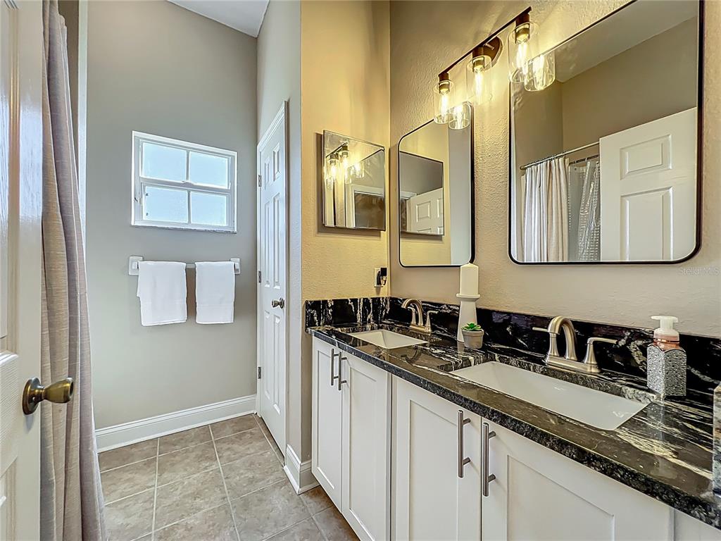 10222 Rockridge Road Lakeland, FL 33810 - Photo 25 of 39 a bathroom with a sink and a mirror