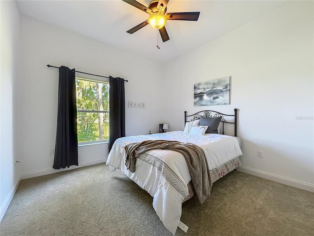 10222 Rockridge Road Lakeland, FL 33810 - Photo 27 of 39 a bedroom with a bed and window