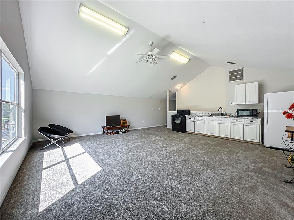 10222 Rockridge Road Lakeland, FL 33810 - Photo 34 of 39 a view of a kitchen with furniture and windows