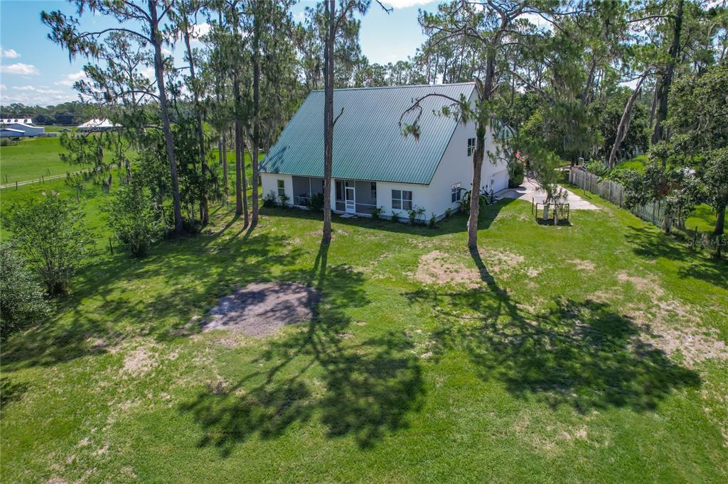 10222 Rockridge Road Lakeland, FL 33810 - Photo 39 of 39 a aerial view of a house with swimming pool and a yard