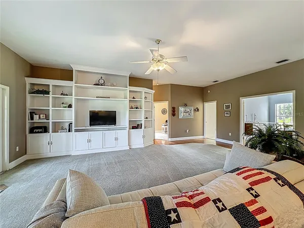 a kitchen with granite countertop a sink a counter space appliances and cabinets