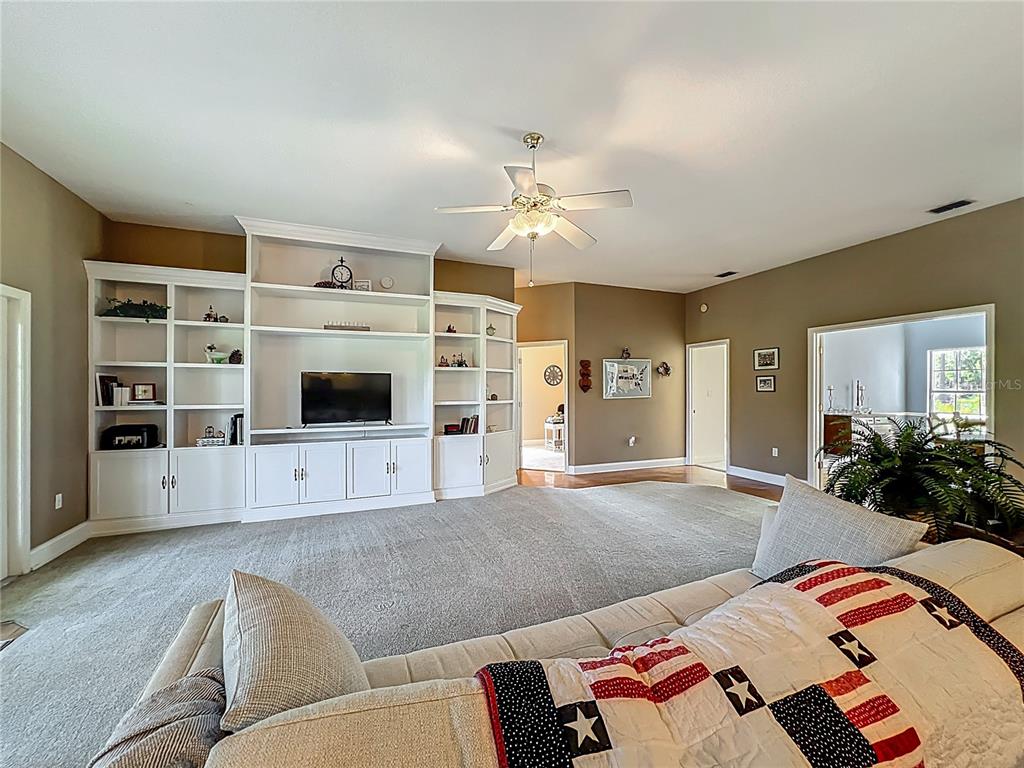 10222 Rockridge Road Lakeland, FL 33810 - Photo 9 of 39 a living room with furniture and a flat screen tv