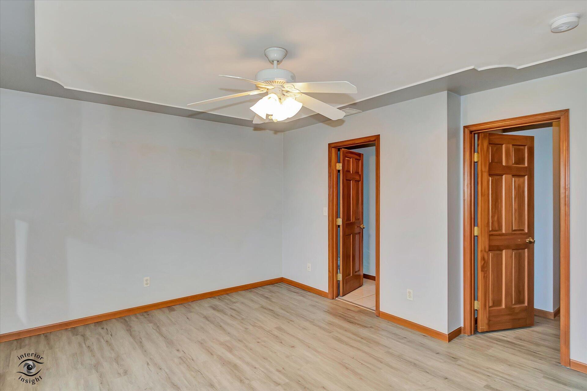 7646 Amanda's Way Crown Point, IN 46307 - Photo 13 of 26 an empty room with wooden floor closet and windows