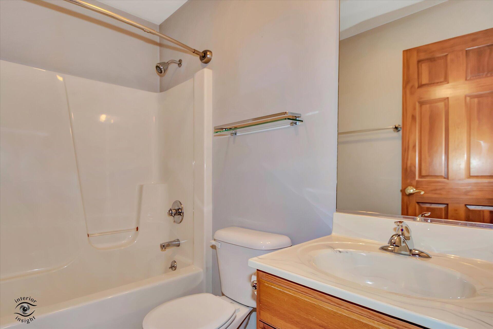 7646 Amanda's Way Crown Point, IN 46307 - Photo 20 of 26 a bathroom with a sink a toilet and shower