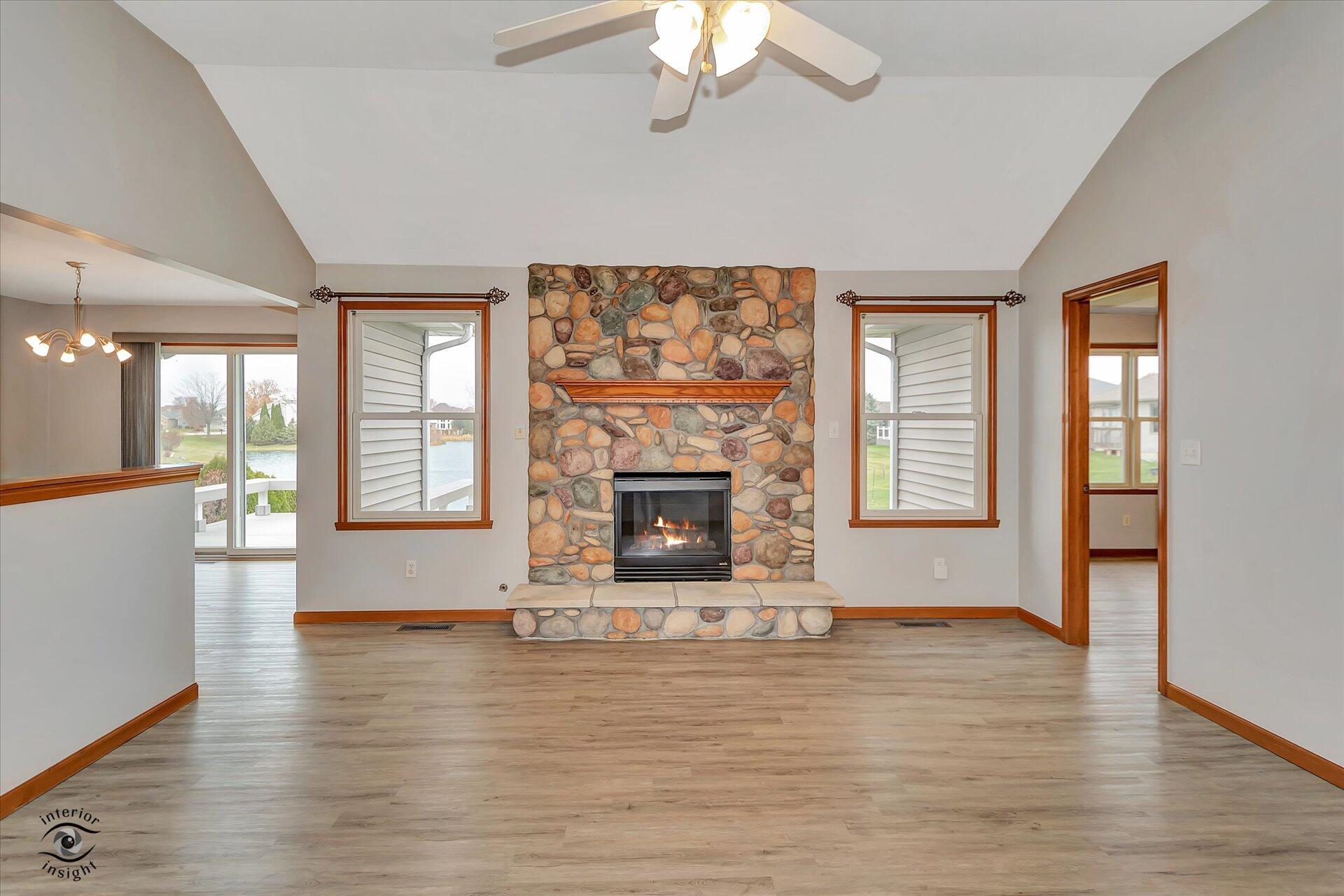 7646 Amanda's Way Crown Point, IN 46307 - Photo 3 of 26 a view of an empty room with wooden floor and a window